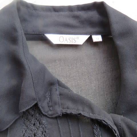 Dainty long sleeve black sheer polyester top made for OASIS in India. With lace inlays on front.