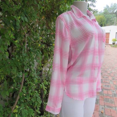 Soft and silky white and pink check long sleeve blouse in 100% polyester chiffon. Size 30 As new