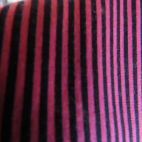 Pretty styled long sleeve blouse in magenta pink and black vertical stripes. By RT in size 38/14