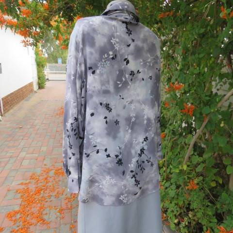 Silver and darker grey coloured long sleeve top with black and white floral pattern, Size 42/18