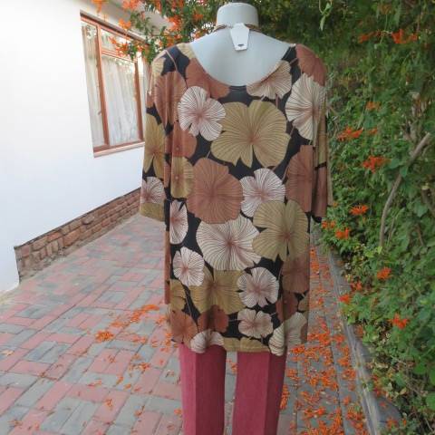 Silky dark brown slip over top with bold beige,gold and brown floral pattern. Short sleeves. Size 50
