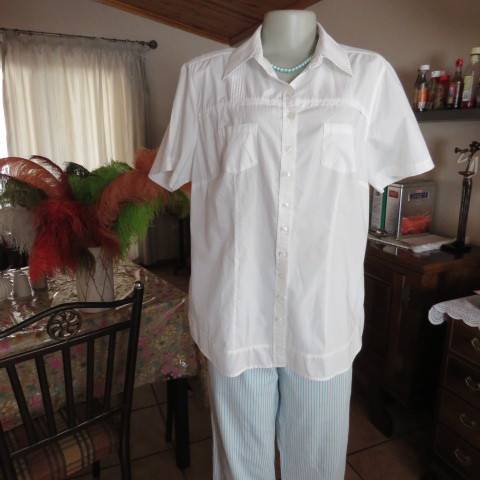 White as new short sleeve 100% cotton ladies shirt. Yoked with tucked decoration. Size 40/16.