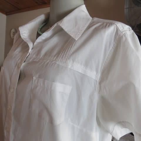 White as new short sleeve 100% cotton ladies shirt. Yoked with tucked decoration. Size 40/16.