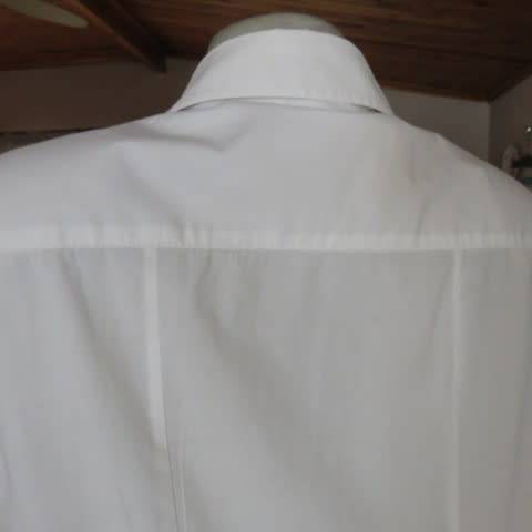 White as new short sleeve 100% cotton ladies shirt. Yoked with tucked decoration. Size 40/16.