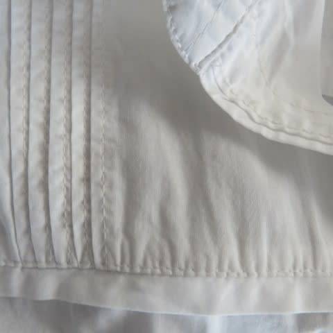 White as new short sleeve 100% cotton ladies shirt. Yoked with tucked decoration. Size 40/16.