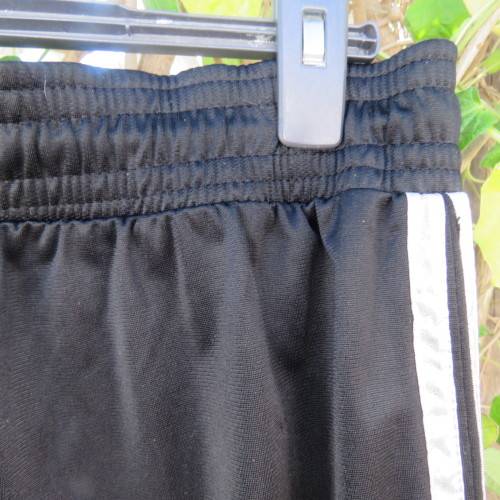 Men's black tracksuite pants with two silver stripes at sides. Size XL by IMAGE. Good condition.