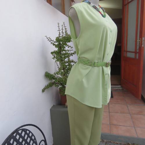 Sleeveless mint green button down top high banded collar. Size 38/14. By WOOLWORTHS. Good condition.