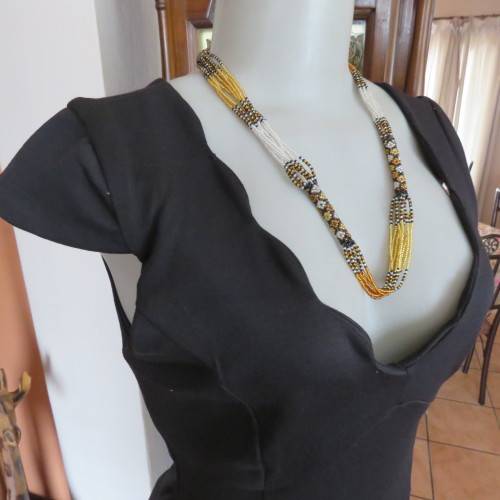 Fabulous sleek black dress with wide scalloped neckline. By `Massumi`. Size 34/10. Never used. New.