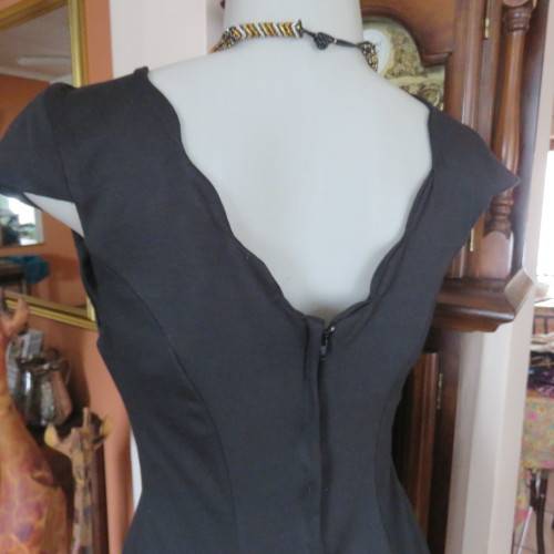 Fabulous sleek black dress with wide scalloped neckline. By `Massumi`. Size 34/10. Never used. New.