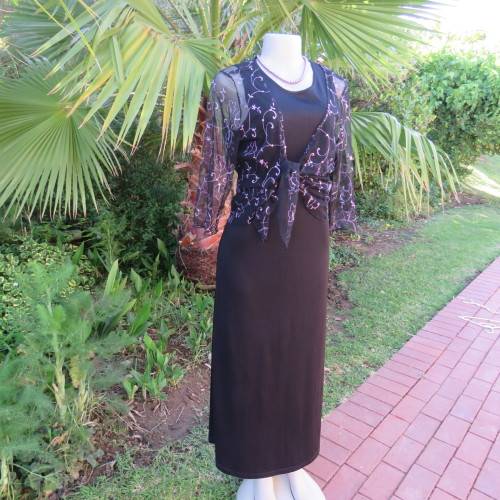 Black sleeveless maxi shift slip-over style dress in size 36/12. Round neckline. New condition.