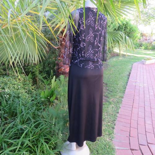 Black sleeveless maxi shift slip-over style dress in size 36/12. Round neckline. New condition.