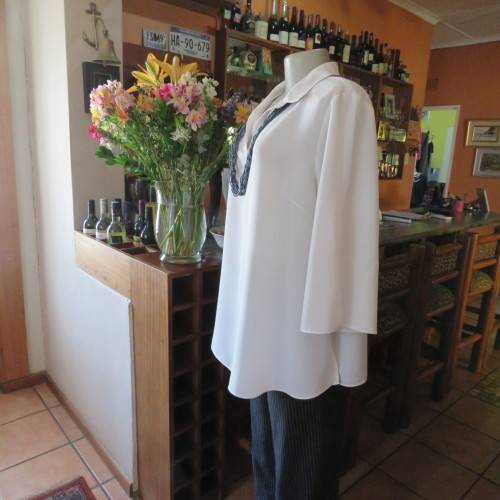 Comfy but smart white slip-over maternity top by `du date` in size 42/18. As new. Slitted sides.