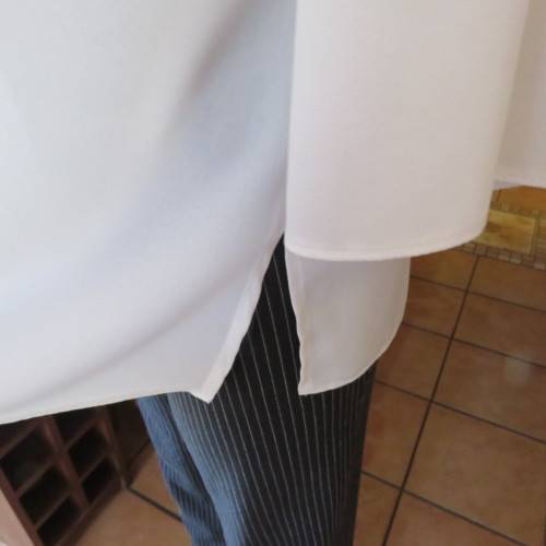 Comfy but smart white slip-over maternity top by `du date` in size 42/18. As new. Slitted sides.