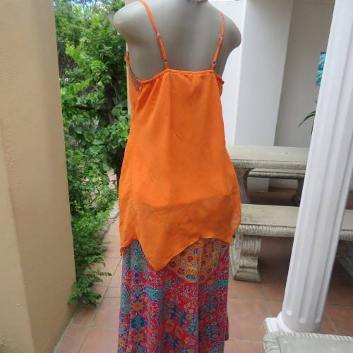 Lovely bright orange top. Thin adjustable straps. Pointed hemline. Size 36/12 by ` Shenga`. As new.