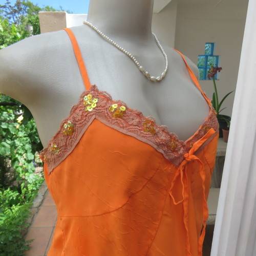 Lovely bright orange top. Thin adjustable straps. Pointed hemline. Size 36/12 by ` Shenga`. As new.