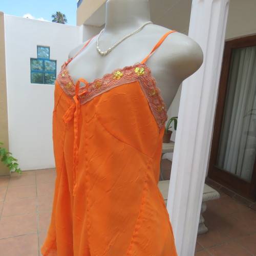 Lovely bright orange top. Thin adjustable straps. Pointed hemline. Size 36/12 by ` Shenga`. As new.