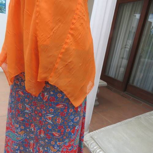 Lovely bright orange top. Thin adjustable straps. Pointed hemline. Size 36/12 by ` Shenga`. As new.
