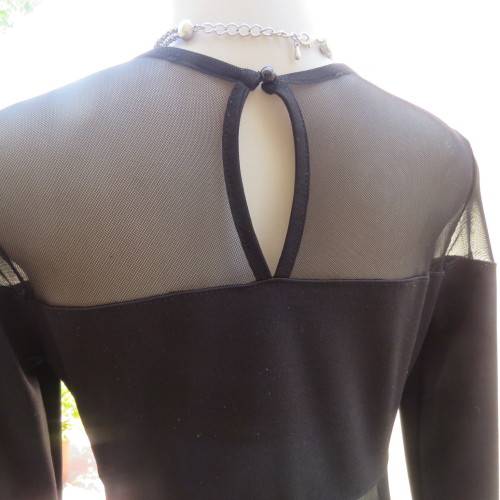 Cute little black bodycon dress with long sleeves in mini length. Size 32/8 by RT. New condition