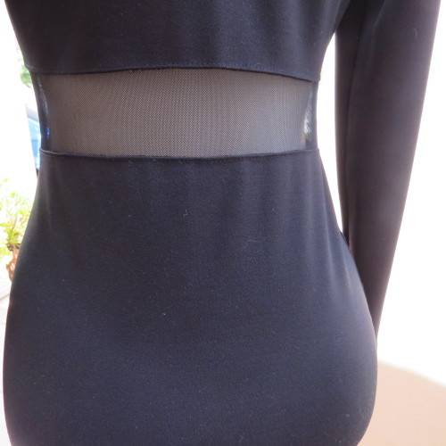 Cute little black bodycon dress with long sleeves in mini length. Size 32/8 by RT. New condition