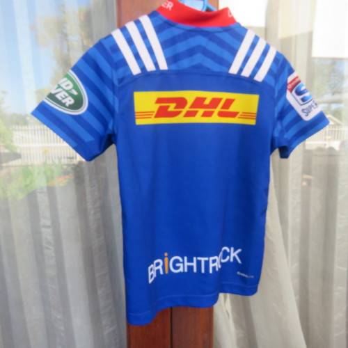 ADIDAS Stomers short sleeve top in blue, white and red. For boy 11 to 12 year old boy. New.