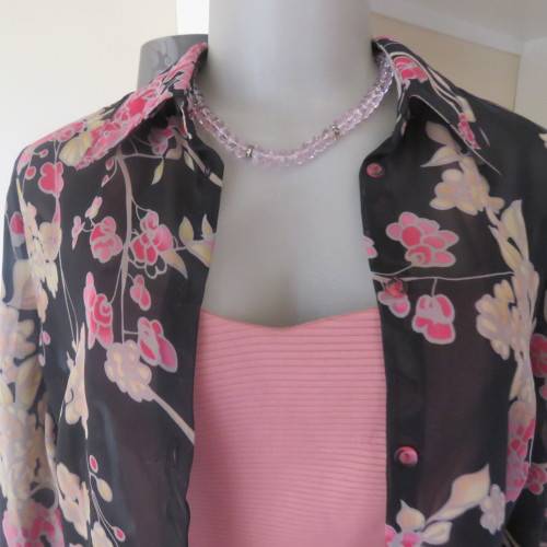 Fabulous black sheer polyester top with pink/cream posies.Size 32/8 by WOOLWORTHS.As new.