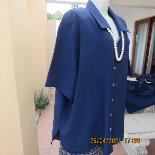 Silky navy 100% polyester short sleeve button down V neck top with Johnny collar.Size 50/26