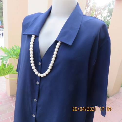 Silky navy 100% polyester short sleeve button down V neck top with Johnny collar.Size 50/26