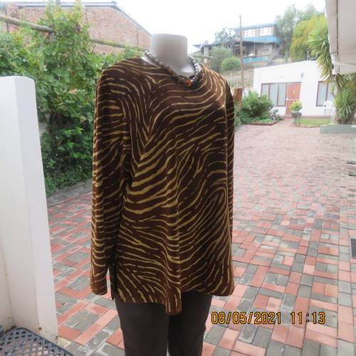 Warm polyester velvet animal print golden brown and caramel long sleeve slip over top.Size 42/18