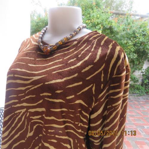 Warm polyester velvet animal print golden brown and caramel long sleeve slip over top.Size 42/18