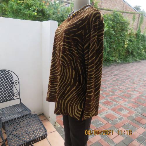 Warm polyester velvet animal print golden brown and caramel long sleeve slip over top.Size 42/18