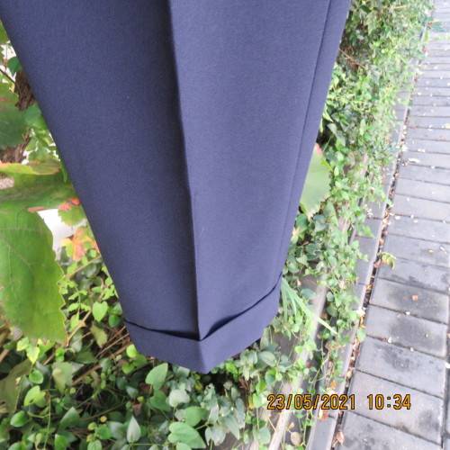 Smart navy Men`s pants by SIGNATURE in size 30. Pleats on front. Turnups on legs. New condition.