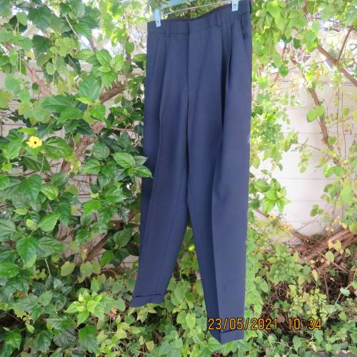 Smart navy Men`s pants by SIGNATURE in size 30. Pleats on front. Turnups on legs. New condition.