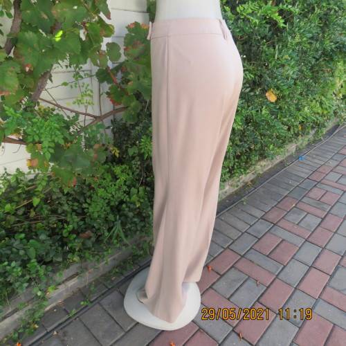 Elegant latte beige pants from WOOLWORTHS size 34/10 with space.Straight legs.Good condition.
