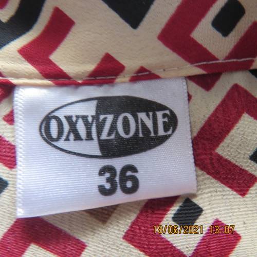 Classic geometric print cream short sleeve top with maroon/black print. Size 36/12.By OXYZONE.