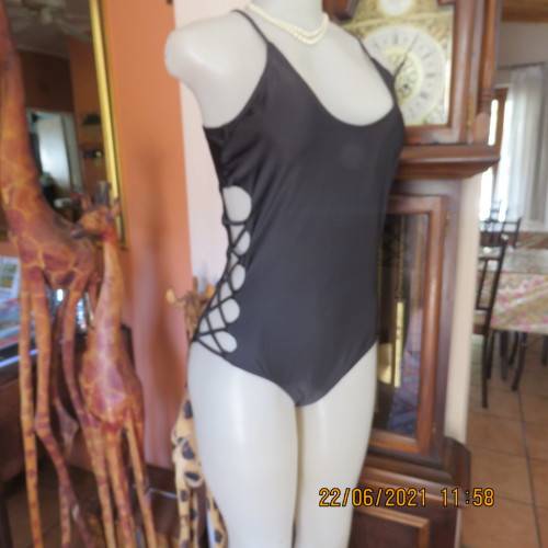 Sexy black one piece swimsuit by MAUI and SONS from USA. Size XL. Braided sides.New condition