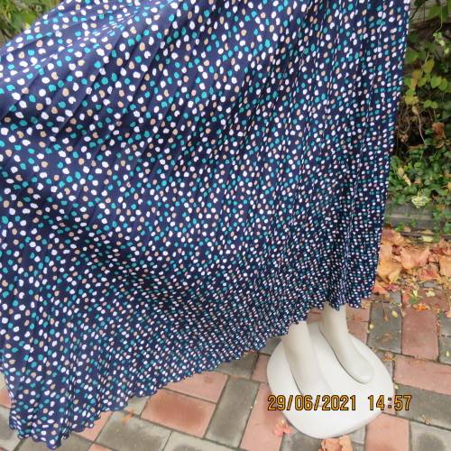 As new half flare permanent pleated navy ankle length skirt with jade/white/cream dots..Size 42/18.