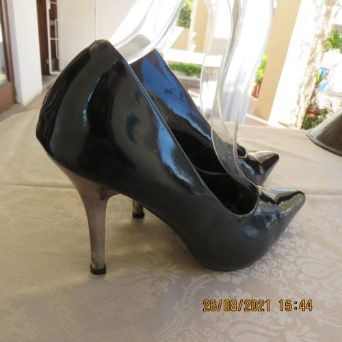 Pair sharp pointed black pumps with patent leather look and silver stiletto heels.By INWEAR size 7.