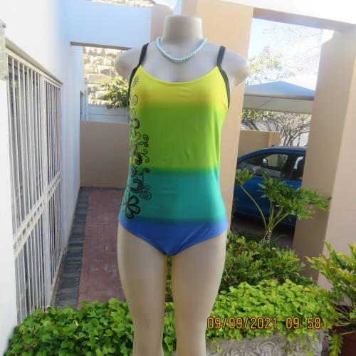 Beautiful one piece swimsuit by SURF SHACK in size 40/16. In blue/turquoise and yellow colour blocks