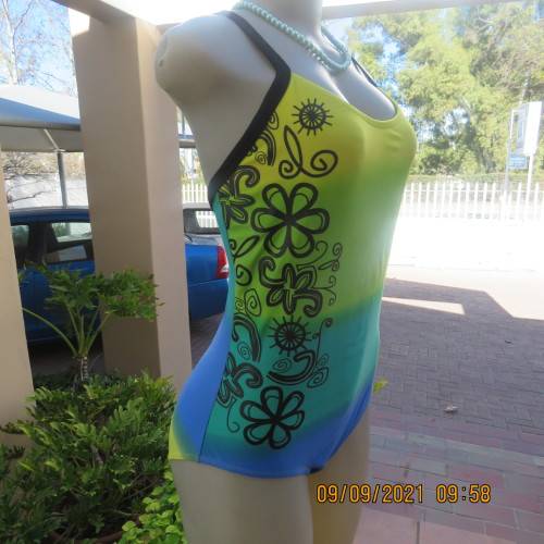 Beautiful one piece swimsuit by SURF SHACK in size 40/16. In blue/turquoise and yellow colour blocks