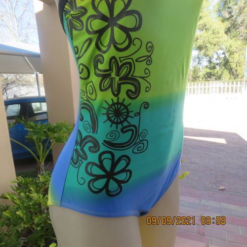 Beautiful one piece swimsuit by SURF SHACK in size 40/16. In blue/turquoise and yellow colour blocks