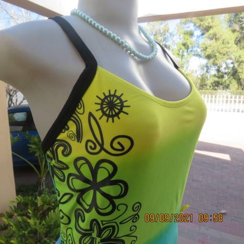 Beautiful one piece swimsuit by SURF SHACK in size 40/16. In blue/turquoise and yellow colour blocks