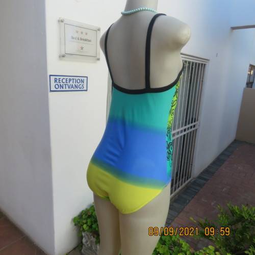 Beautiful one piece swimsuit by SURF SHACK in size 40/16. In blue/turquoise and yellow colour blocks