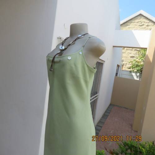 Go feminine in this apple green strappy fully lined dress.Size 36/12 by DEFINE.In linen/cotton blend