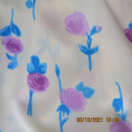 Easy to wear vanilla yellow ankle length straight vintage skirt with blue/lilac flowers. Size 38/14