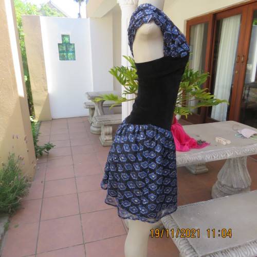 Youthful black velvet dropped waist dress. Acrylic lace,blue,gold skirt and shoulders.Size32 byOTT