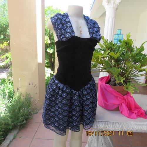 Youthful black velvet dropped waist dress. Acrylic lace,blue,gold skirt and shoulders.Size32 byOTT