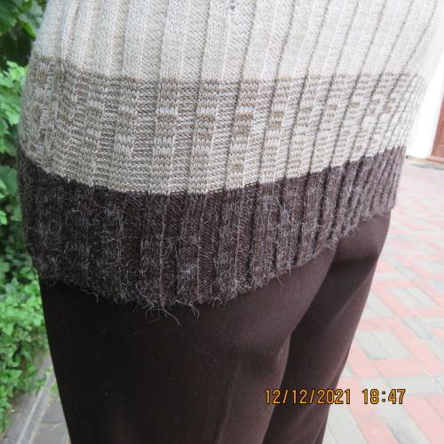 Knitted poloneck top in wide brown and cream horizontal lines. Acrylic yarn.Rib stich. Size 36 to 38