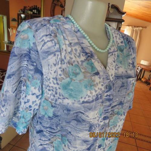 Exquisite 100% rayon CUPID short sleeve top in medley of blues and turquoise.Button down.New cond.