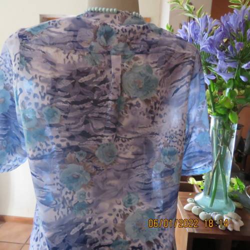 Exquisite 100% rayon CUPID short sleeve top in medley of blues and turquoise.Button down.New cond.