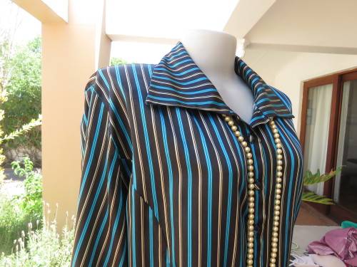 Fabulous long sleeve striped top in brown,cream and tuequoise.Size 48/24 by JUDY`S PRIDE.Button down